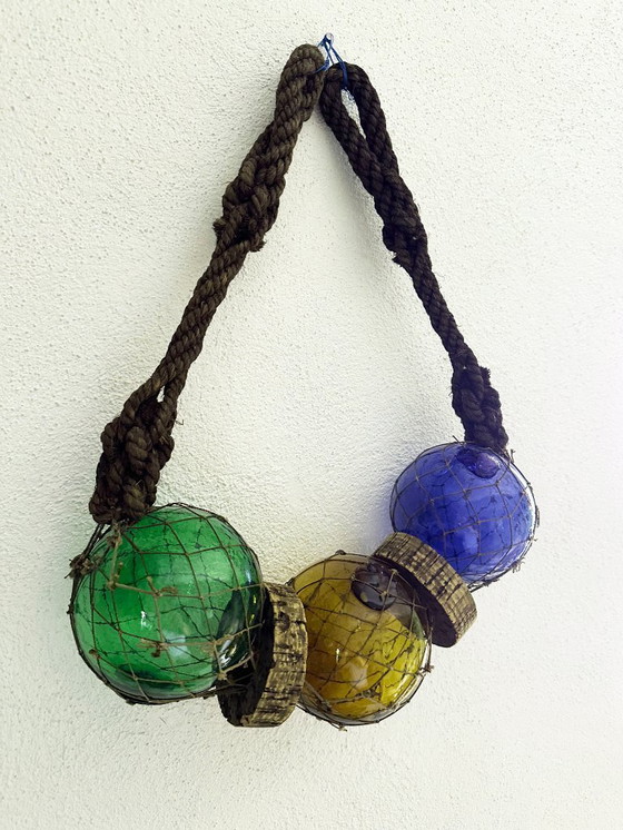 Image 1 of Fishing float made of blown glass, cork, and rope. France, 1960s