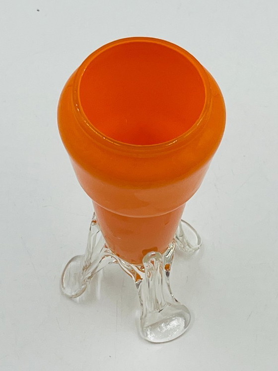 Image 1 of Vintage orange glass bud vase with a sculpted base