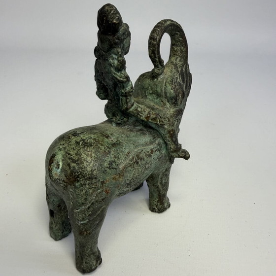 Antique bronze sculpture of man on elephant (photo 9 of 12)