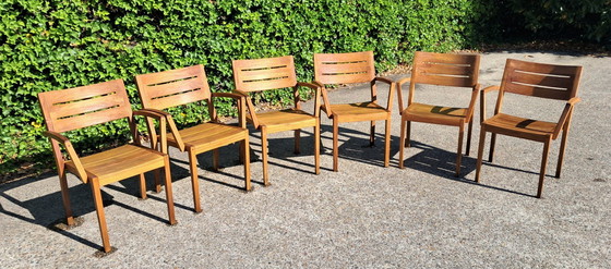 Image 1 of 6 Traditional Teak stacking chairs with armrests