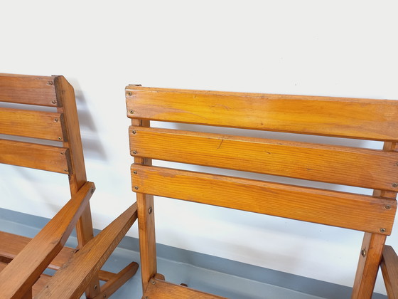 Image 1 of Vintage garden furniture consisting of a table with extensions and 4 wooden armchairs from the 60s