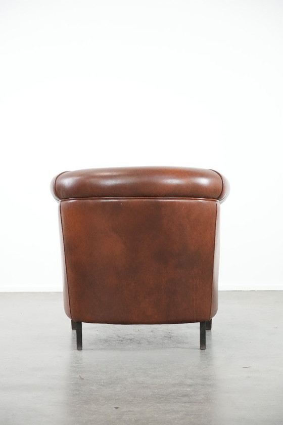 Image 1 of Cognac-colored cowhide leather club armchair in English style with a luxurious appearance