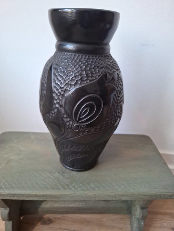 Image 1 of Tall black bakelite vase with unusual tulip decor, beautiful vintage object in very good and usable condition!