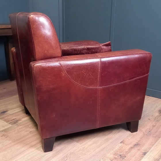 Image 1 of Timeless cowhide leather club armchair, atmospheric and inviting.