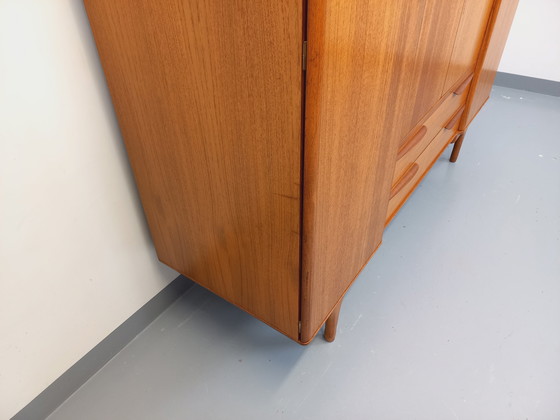 Image 1 of Scandinavische vintage kledingkast in teakhout uit de jaren 60 van ontwerpers Tricoire en Vecchione voor "Meubles TV Paris".