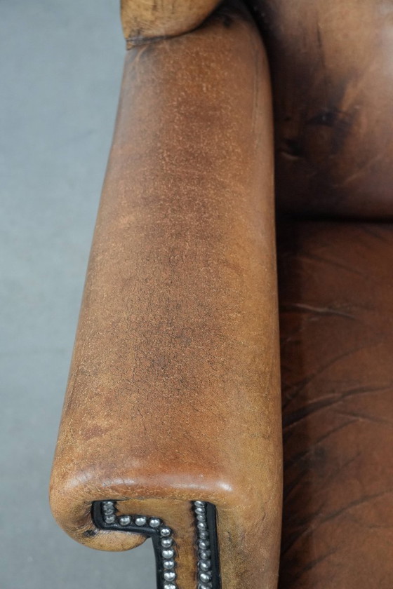 Image 1 of Sheepskin wing chair with a characterful appearance