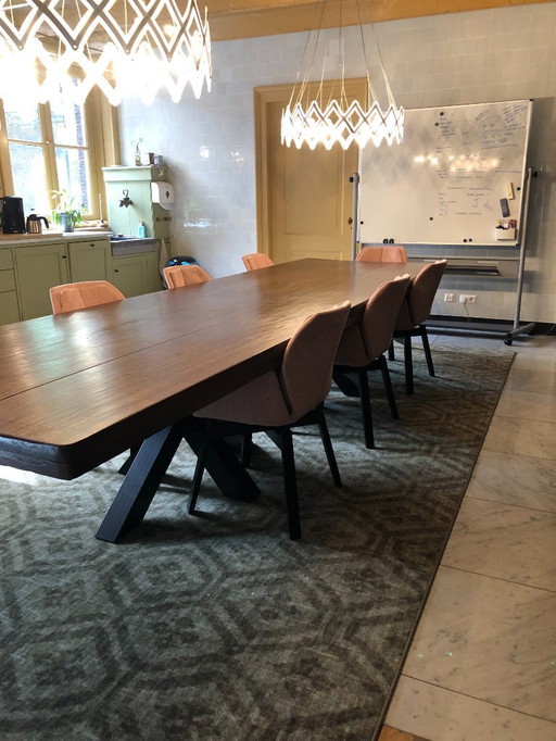 Sturdy solid oak table with 2 metal cross legs