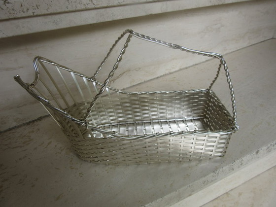 Image 1 of Porte-bouteille de vin vintage en fil de fer argenté.
