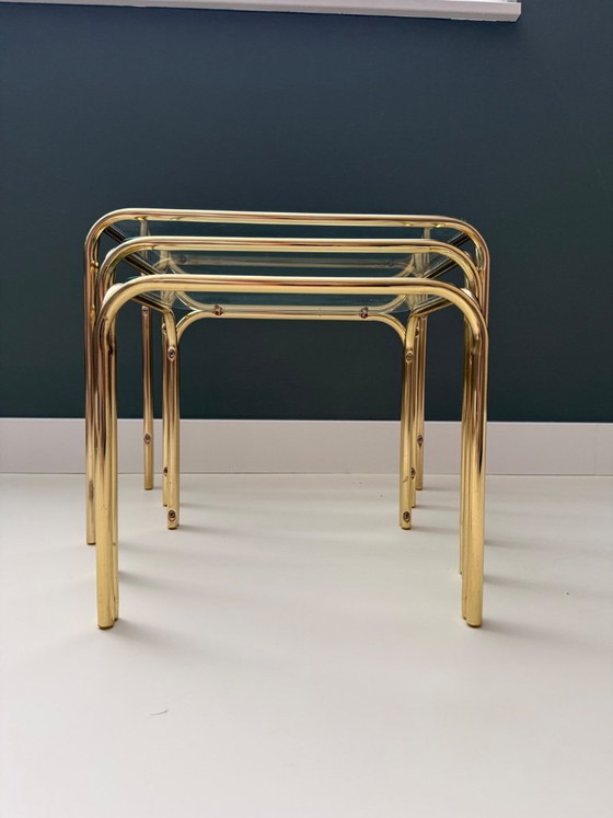 Image 1 of Vintage Mid Century Modern Chrome en glazen bijzettafelset van 3