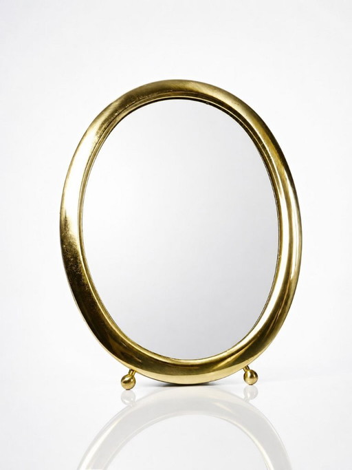 Ovale tafelspiegel met een vintage gouden metalen lijst uit de jaren 1950-1960.