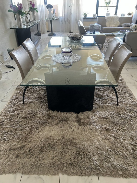 Image 1 of Glass dining table incl. 4 grey leather chairs