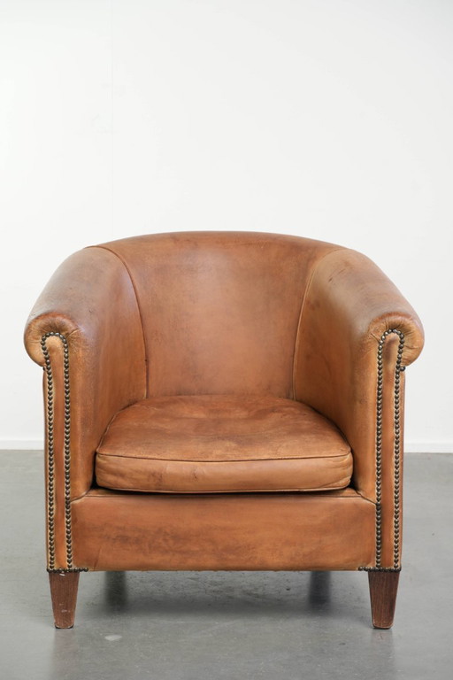 Lovely vintage sheepskin club armchair in a beautiful light cognac color with a beautiful patina and a (photo 2 of 14)