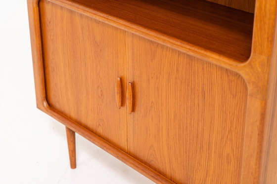 Image 1 of Bookcase in teak by Svend Dyrlund with tambour doors (Denmark, 1960s).