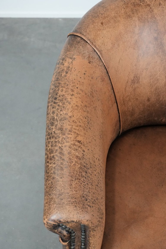 Image 1 of Timeless vintage sheepskin club armchair with character and a beautiful patina
