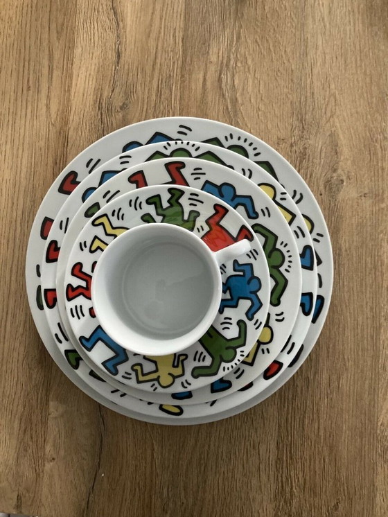 Image 1 of Keith Haring Dinnerware: 3 different sized plates, 1 coffee cup and saucer.