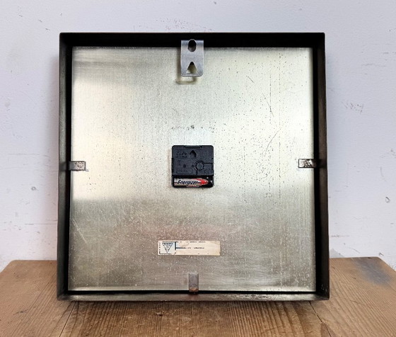 Image 1 of Zwarte industriële vierkante wandklok van Pragotron, jaren 70