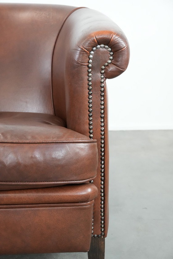 Image 1 of Cognac-colored cowhide leather club armchair in English style with a luxurious appearance