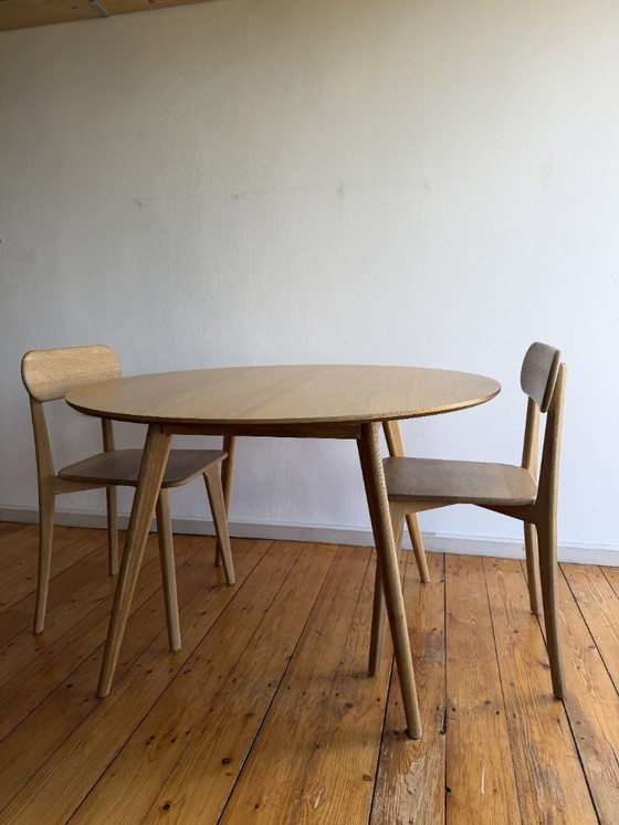Image 1 of Round oak table with solid oak chairs