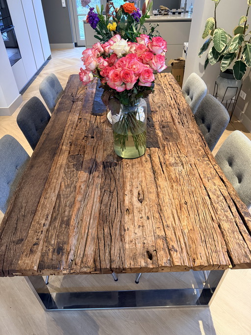 Wooden (ship's wood treated) dining table with stainless steel base