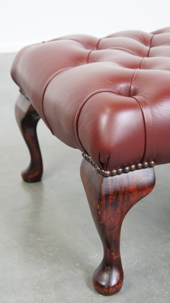 Image 1 of Elegant red/brown Chesterfield stool in very good condition