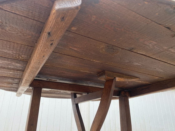 Image 1 of antique folding round winemaker's target table with tilting top