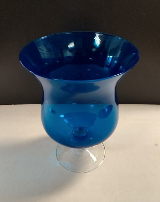 Blue glass vase on foot
