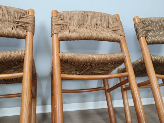 Image 1 of Juego de 8 sillas estilo Charlotte Perriand de los años 60, de paja tejida y madera.