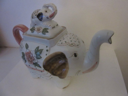 Elephant shaped teapot, white ceramic with floral pattern