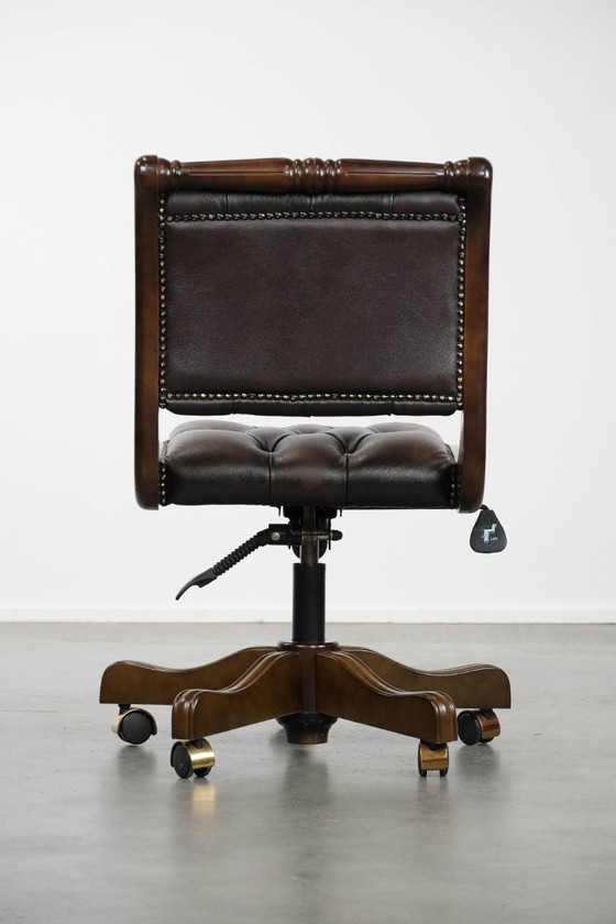 Image 1 of English-style Chesterfield office chair made of cowhide and wood on wheels