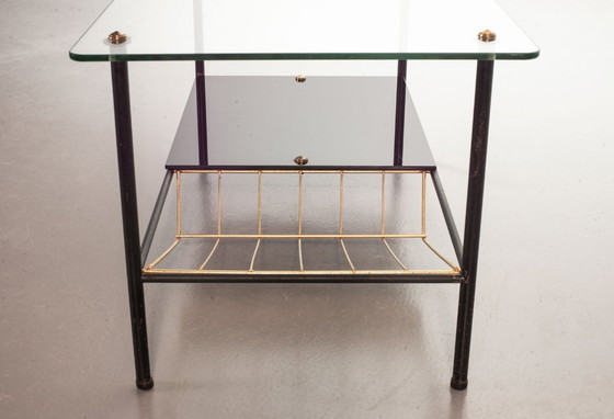 Image 1 of Mid-Century Pierre Guariche Glass Coffee / Side Table for Airborne in Black Steel with Brass Magazine Holder. France, 1950s. 