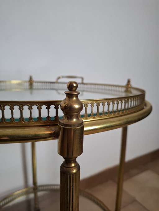 Bar trolley with glass and brass tray.