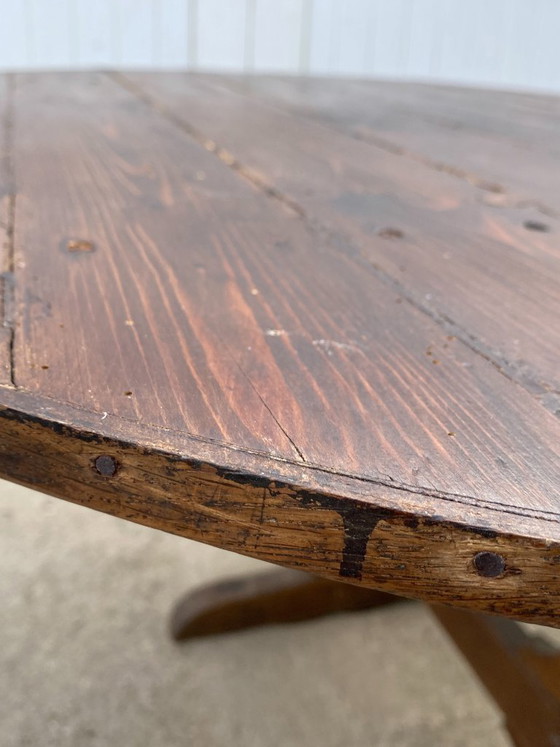 Image 1 of antique folding round winemaker's target table with tilting top