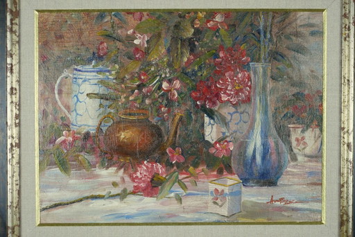 Still life with pink flowers and blue pots.