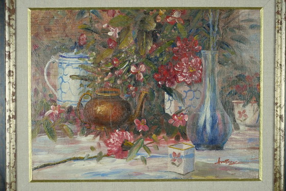 Image 1 of Still life with pink flowers and blue pots.
