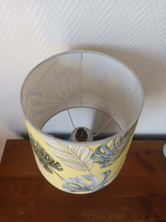Image 1 of Blue ceramic lamp with claw feet and foliage lampshade