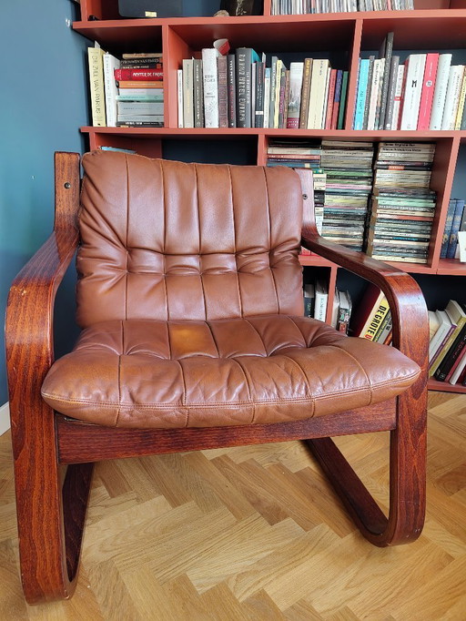 Poltrona vintage in pelle cognac e palissandro