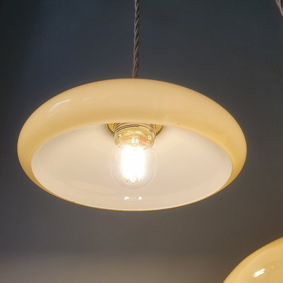 Image 1 of Vintage French pendant lamp set - of pastel yellow opaline glass.