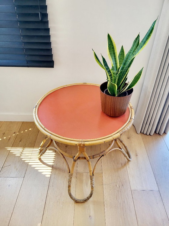 Image 1 of Rattan Couchtisch Modell Diabolo, Design KOK mit orangefarbener Platte
