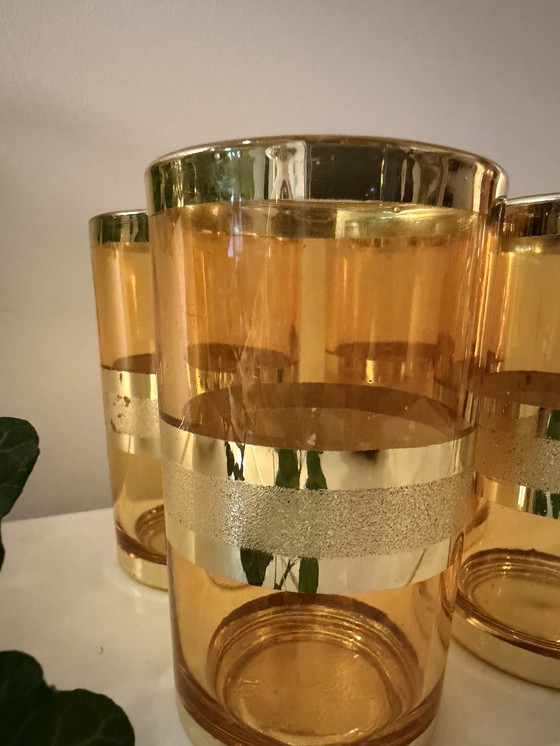 Image 1 of Set van 4 amberkleurige glazen met goudkleurige band