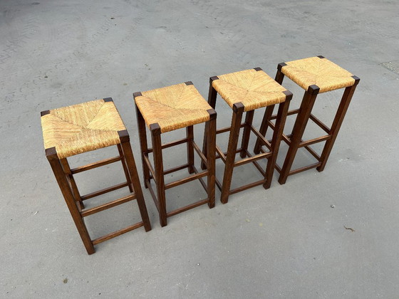 Image 1 of set van 4 houten barkrukken met rotan zitting