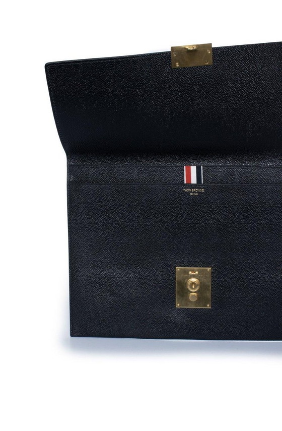 Image 1 of Thom Browne, pochette in pelle martellata con portafoglio