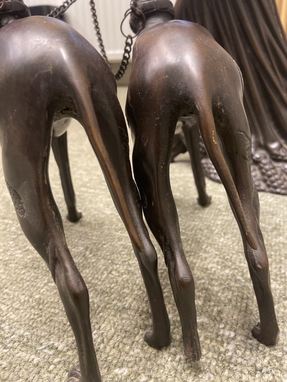 Image 1 of Metal Statue Of Woman With Two Leashed Dogs