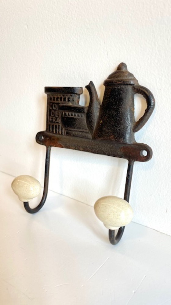 Image 1 of Kapstok van gietijzer en porselein