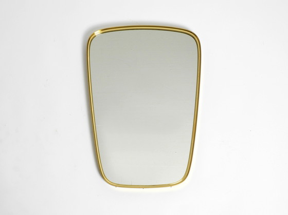 Image 1 of Magnifique miroir mural original du Mid Century Modern "Münchener Zierspiegel" avec cadre en laiton lourd