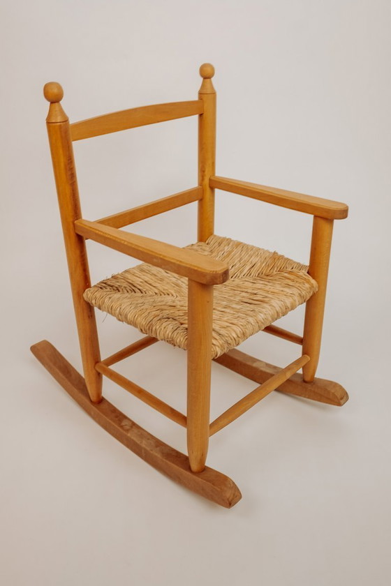 Image 1 of Vintage wooden children's rocking chair with rush seat