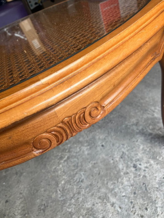 Vintage oval coffee table in French Louis XV style is made of cherry wood and features a glass top over (photo 7 of 8)