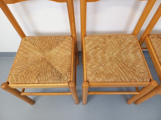 Image 1 of Suite van 4 Vintage Brutalistische stoelen in licht hout en stro uit de jaren 70 en 80