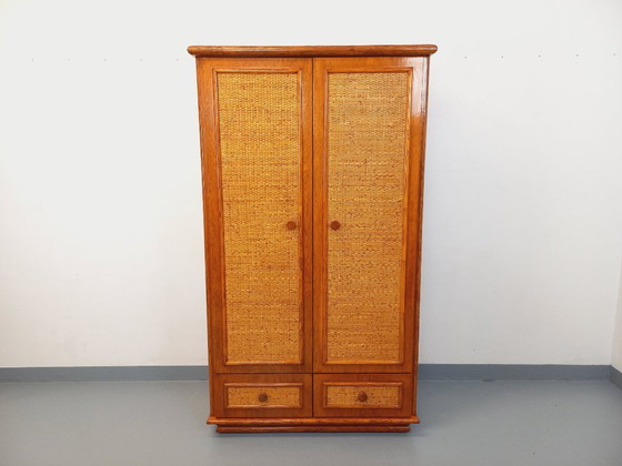 Image 1 of Armadio vintage Maugrion in rattan intrecciato e legno per Roche-Bobois, risalente agli anni '70.