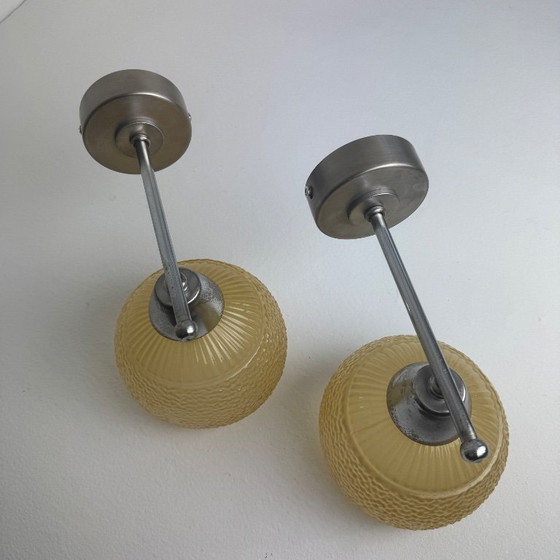 Image 1 of PAAR VINTAGE AMBERKLEURIGE WANDLAMPEN