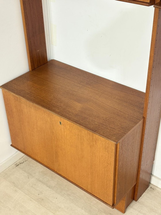 Modular mid-century wall shelf by interna-Peter Pedrides / Teak shelving system 1960s – Shelving unit, Wood (photo 8 of 27)